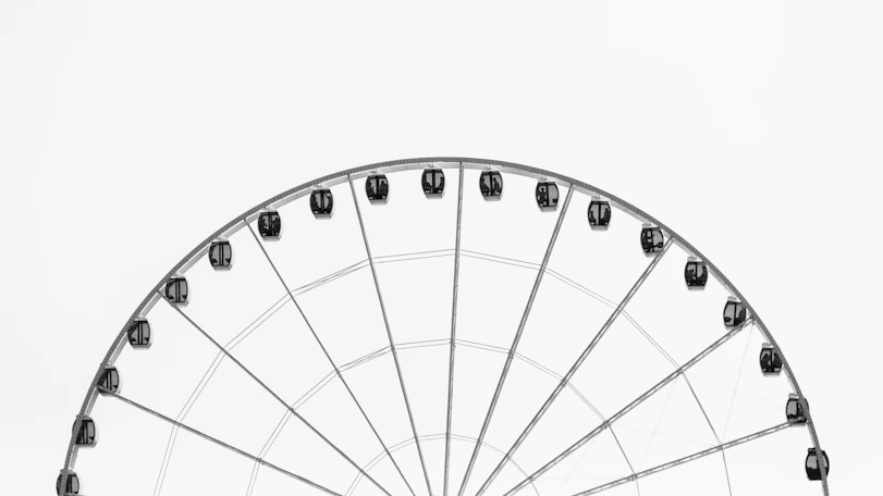 photo of grey and black ferris wheel during daytime