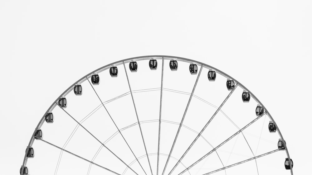 photo of grey and black ferris wheel during daytime