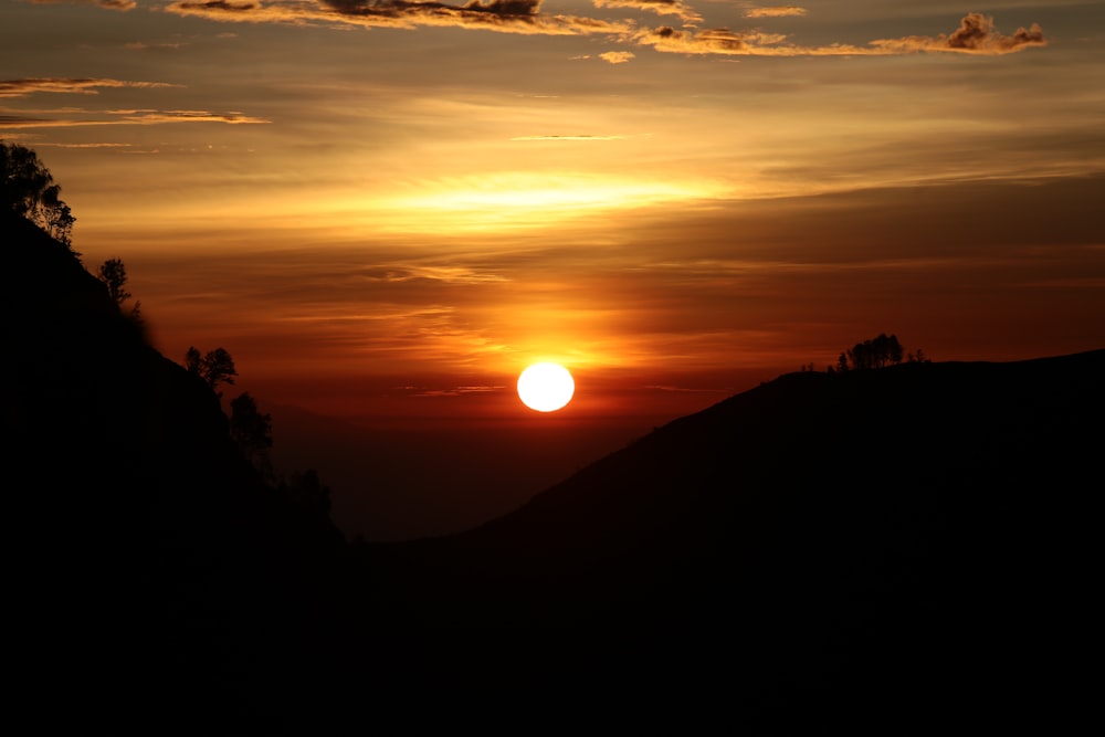 silhouette of mountain during sunset