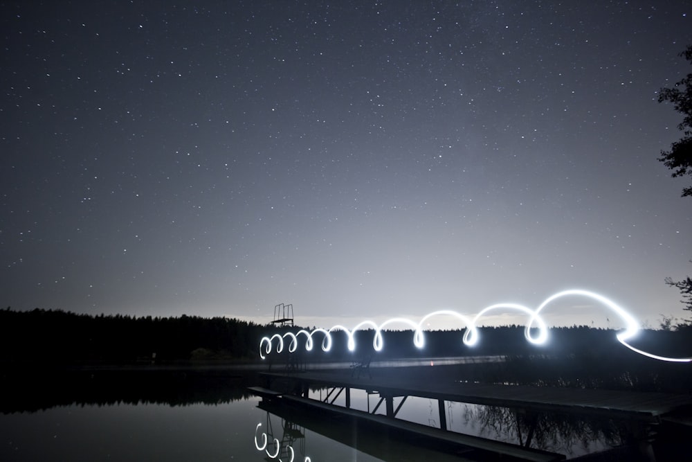 photo of bridge near body of water