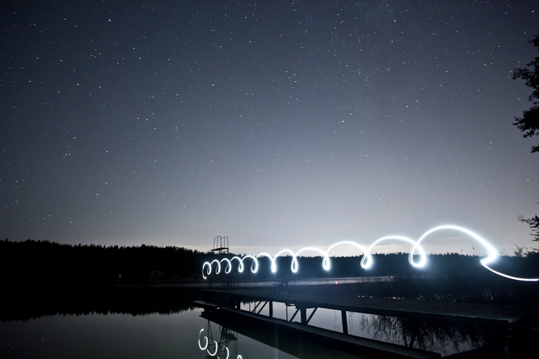 photo of bridge near body of water