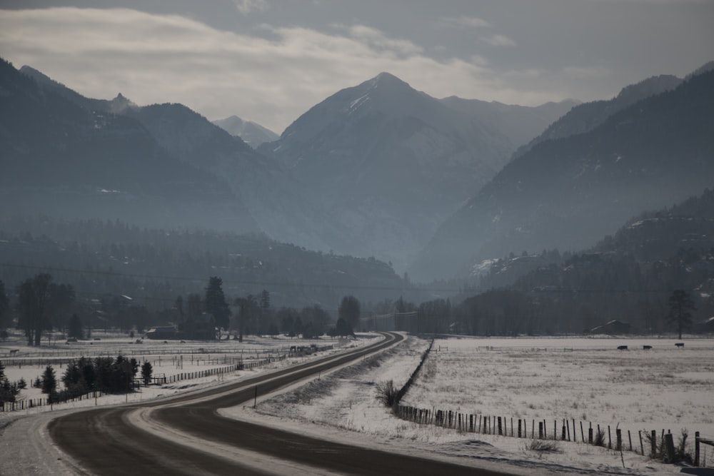 photo of road towards mountains