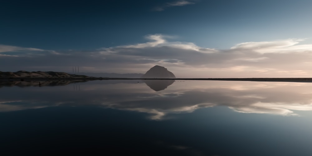 open ocean reflecting white clouds