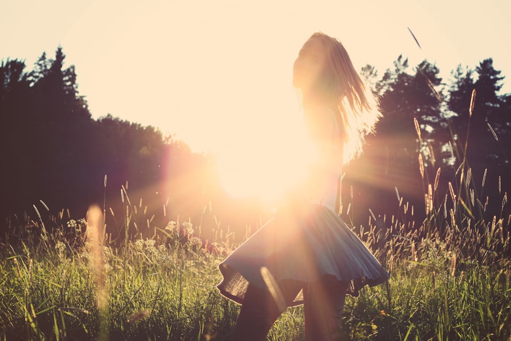 woman standing on grassfield