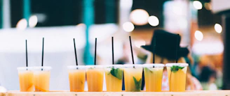 Clear plastic cups filled with refreshing beverages, ready for fast food service.