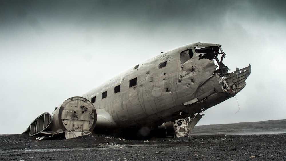 grayscale photo of wrecked plane