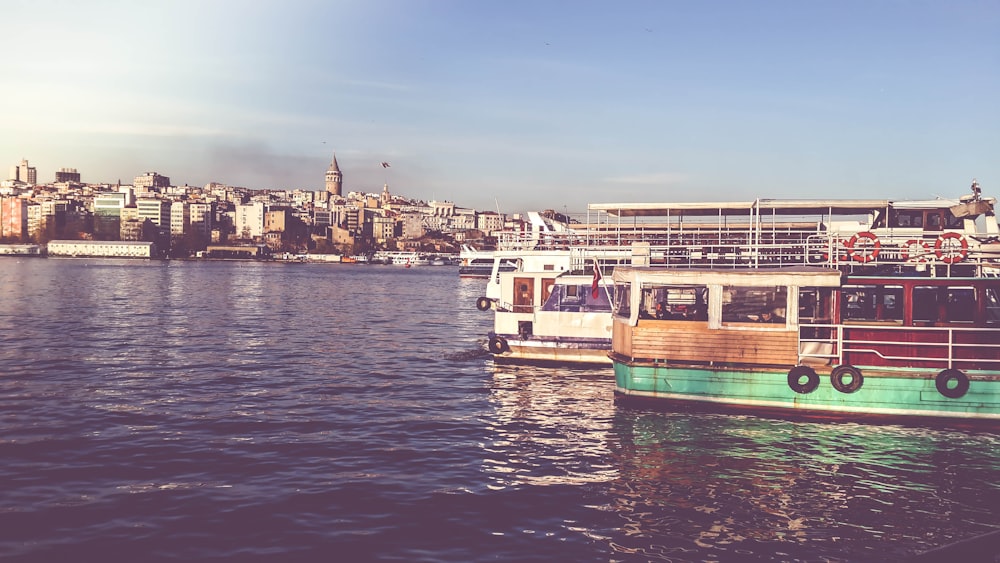 two passenger boats on water during daytime