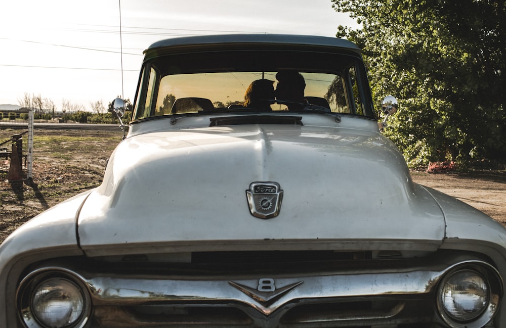 man and woman kissing inside the car