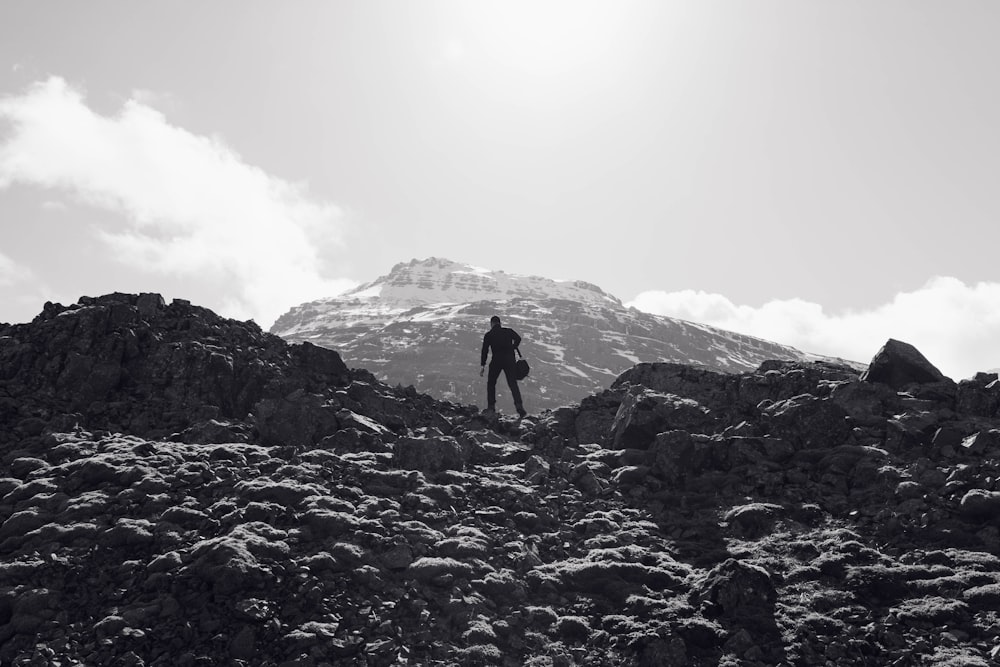 man on top of mountain during daytime