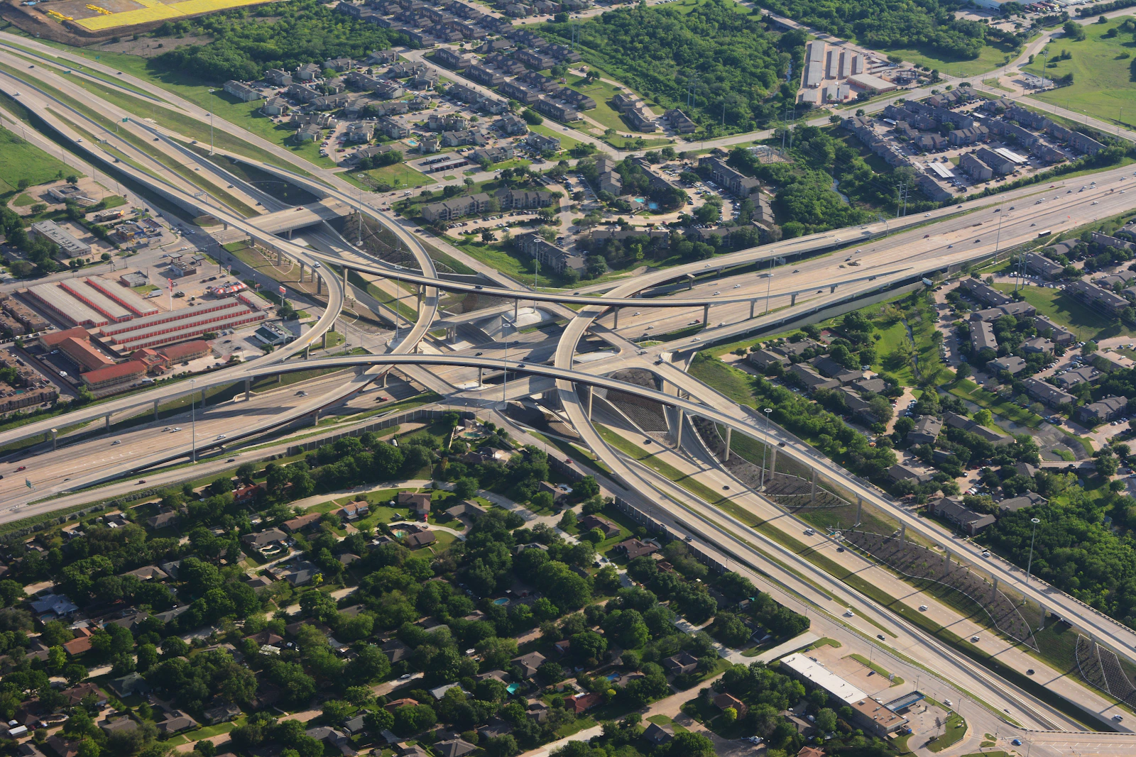 An aerial view of a highway bypass lane cutting past a long line of traffic — the shortcut this pitch takes around Swift's type checker