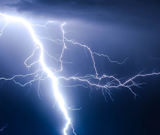 lightning strike during blue sky