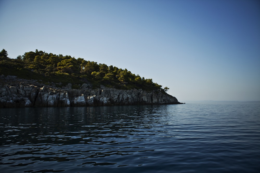 body of water near mountain