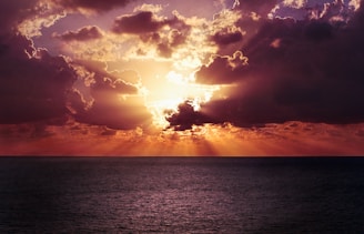 photo of a body of water and sunrise