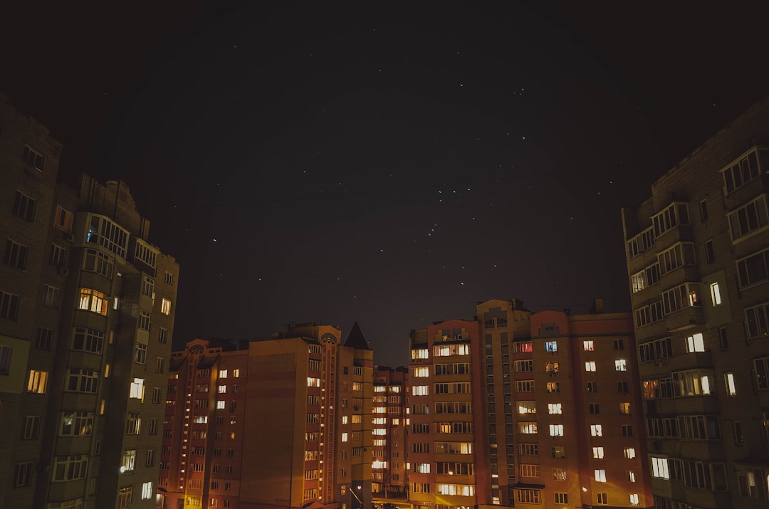 buildings under starry night sky