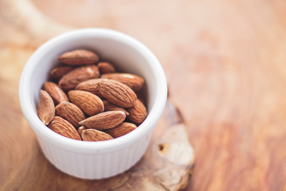 Ramekin of raw almonds for a healthy snack