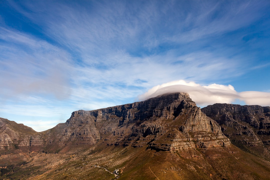 rock mountain under white and blue sky during daytime