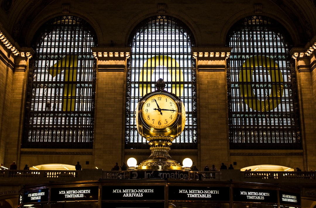 gold clock with time of 11:15