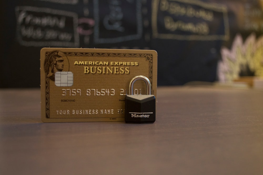 closeup photo of American Express Business card on brown surface