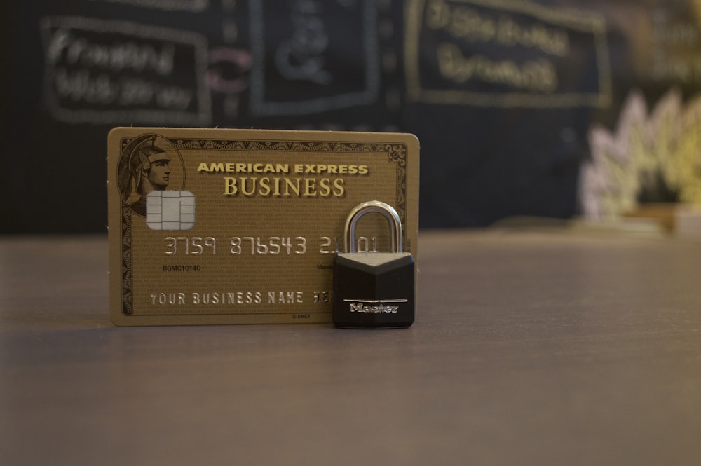 closeup photo of American Express Business card on brown surface