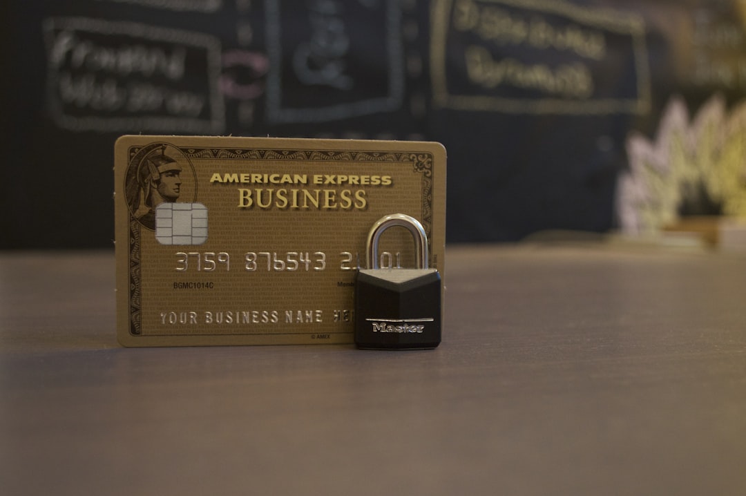 closeup photo of American Express Business card on brown surface, AMEX business credit card