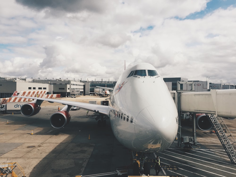 white airplane on gray concrete floor