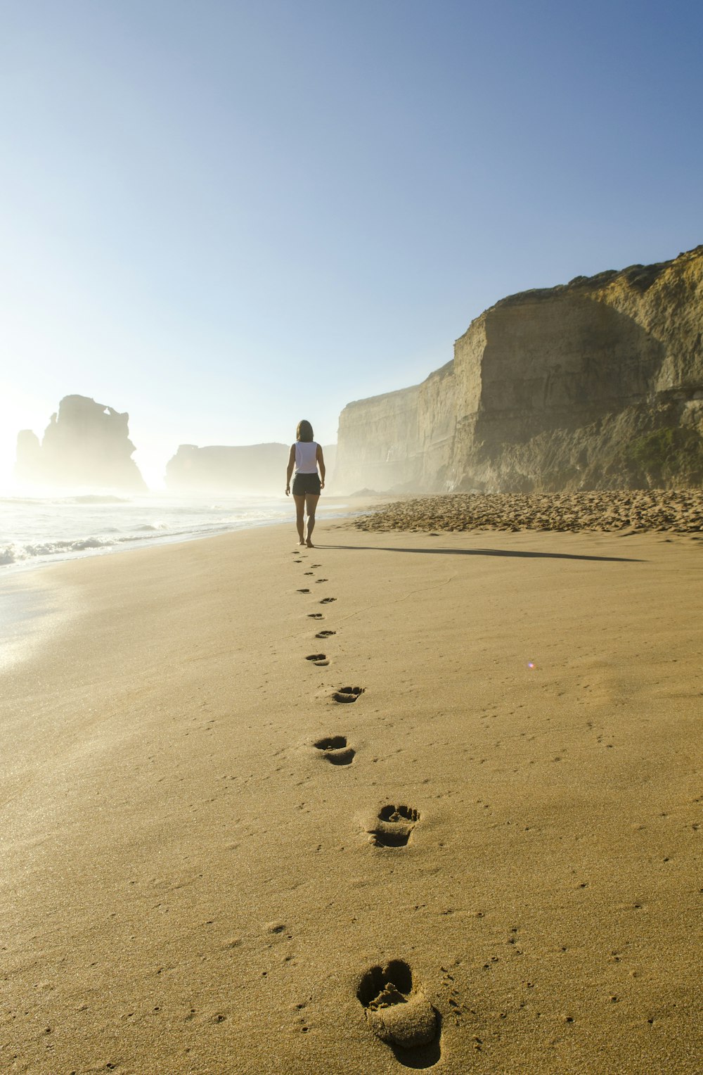 woman walking on shore