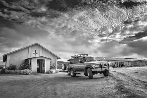A Road to Sinai vehicle parked outside a church during a community event.