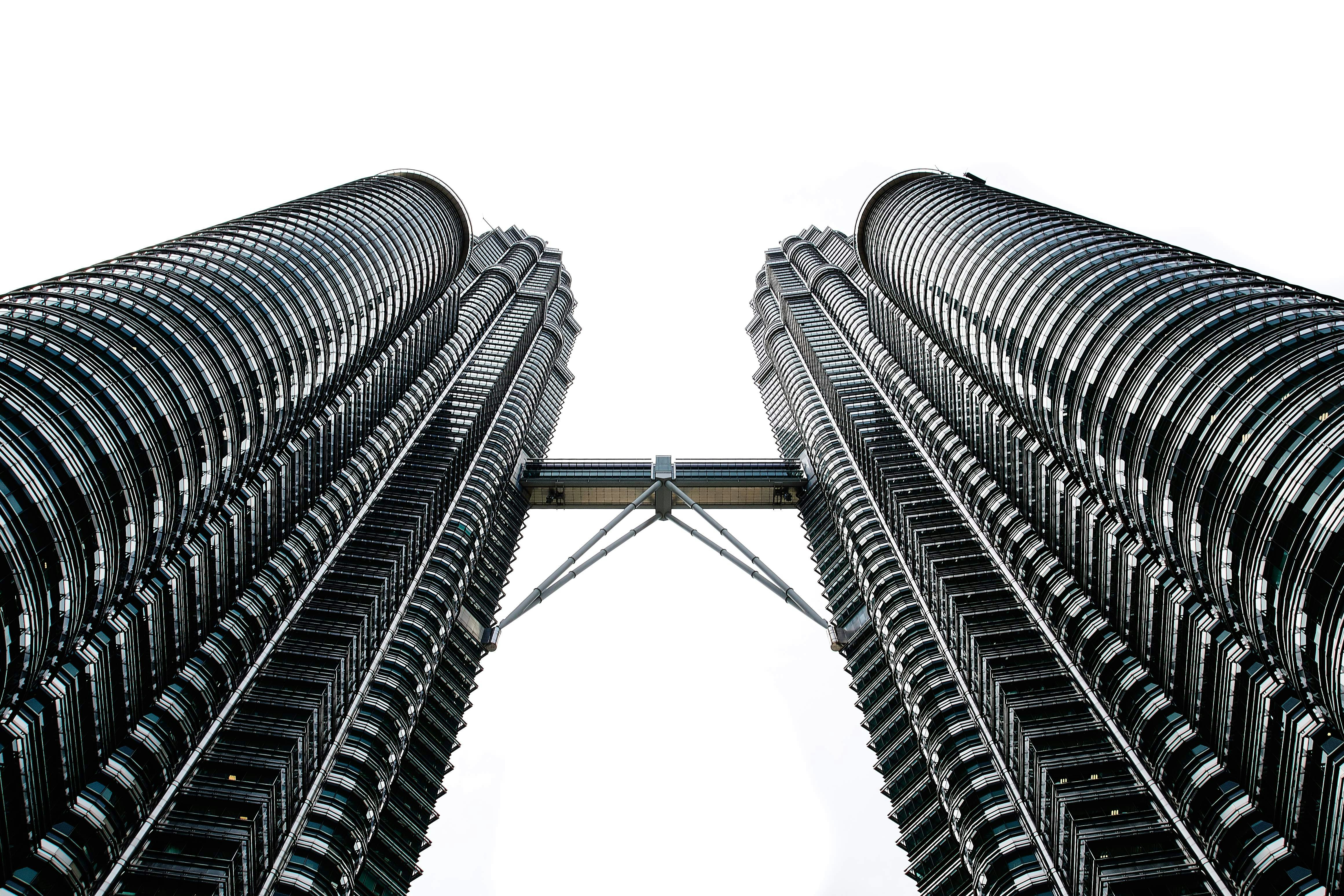 worms eyeview photography of Petronas Tower during daytime