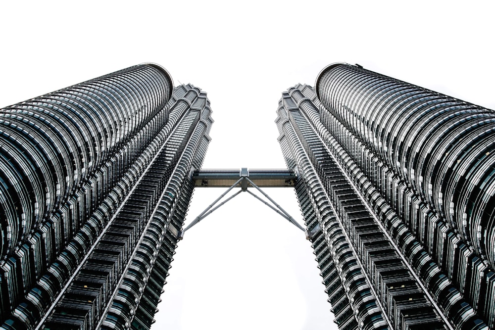 worms eyeview photography of Petronas Tower during daytime