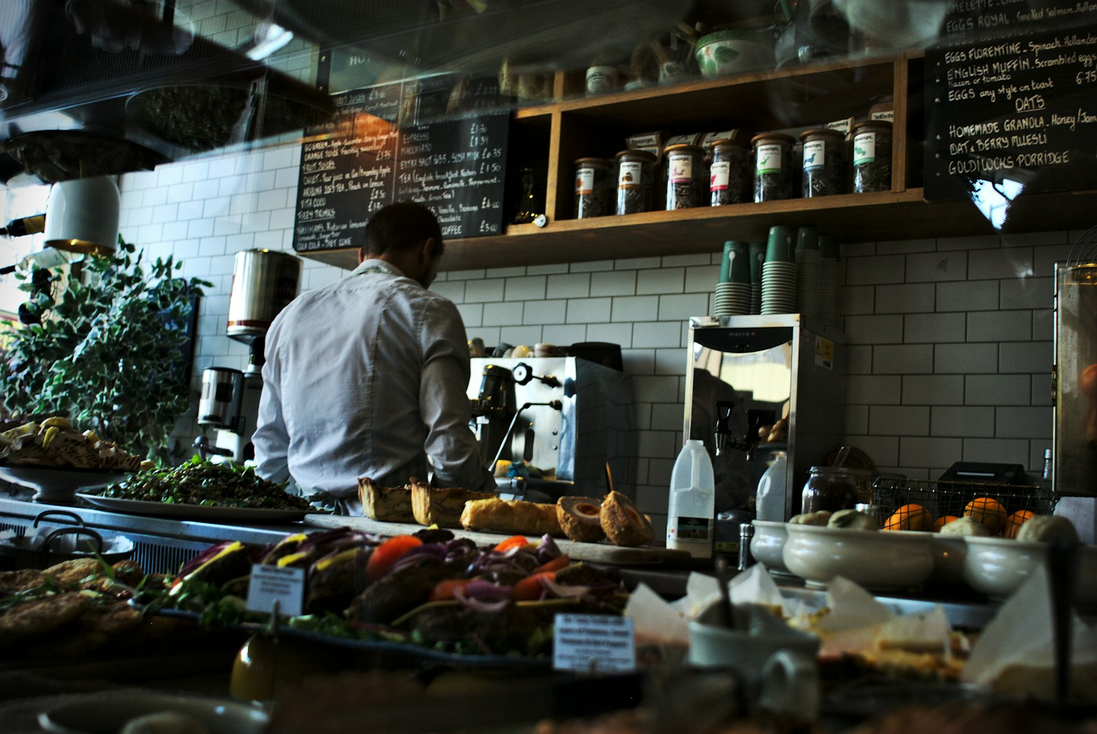 Nikon D80 + Nikon AF Nikkor 24mm F2.8D sample photo. Man standing beside espresso photography