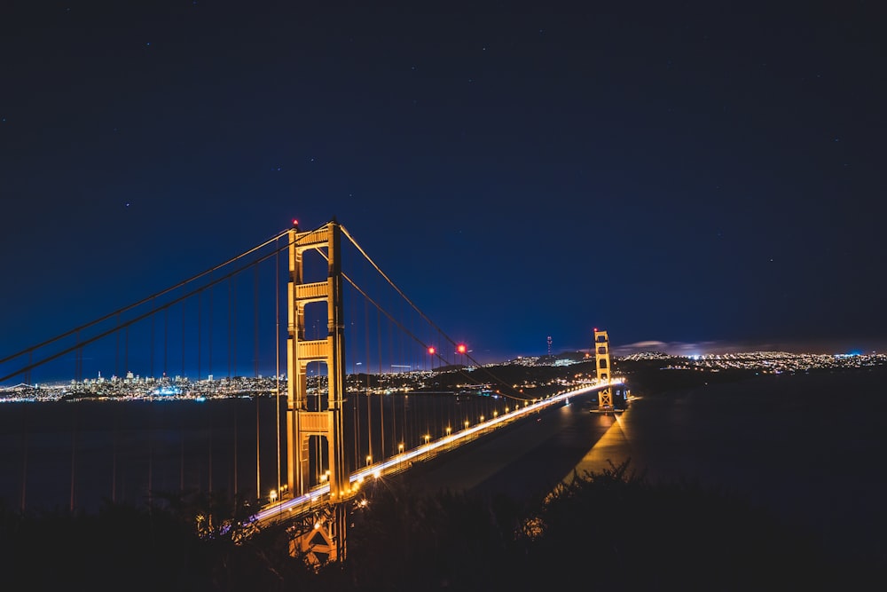 lighted bridge during nighttime