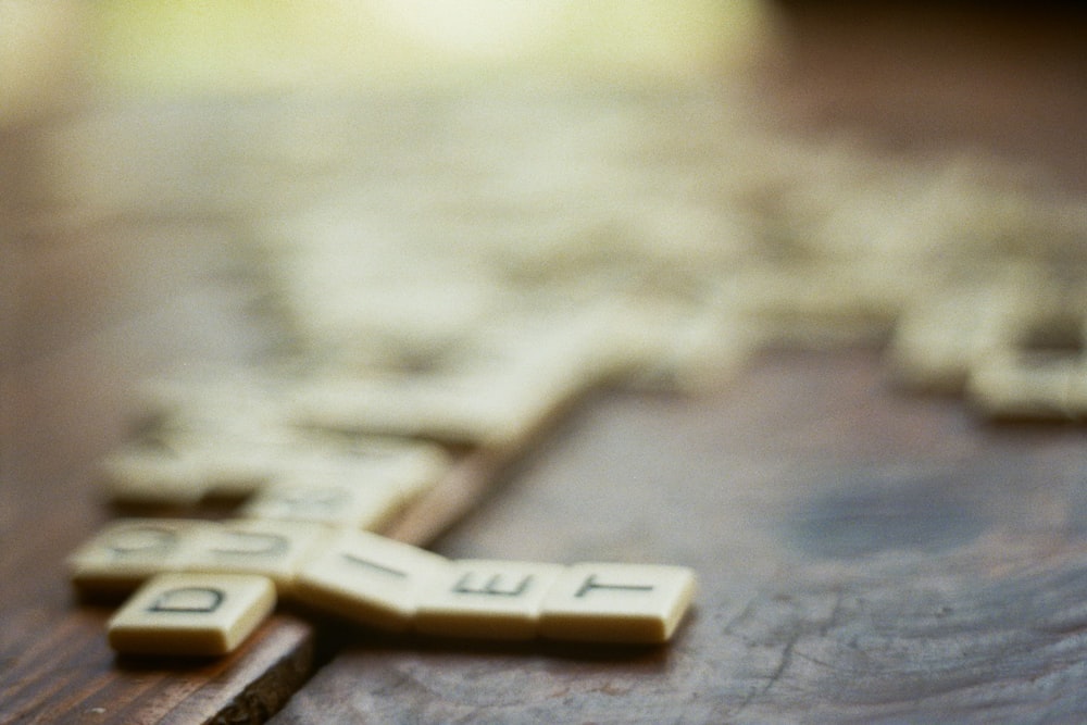 shallow focus photography of scrabble pieces
