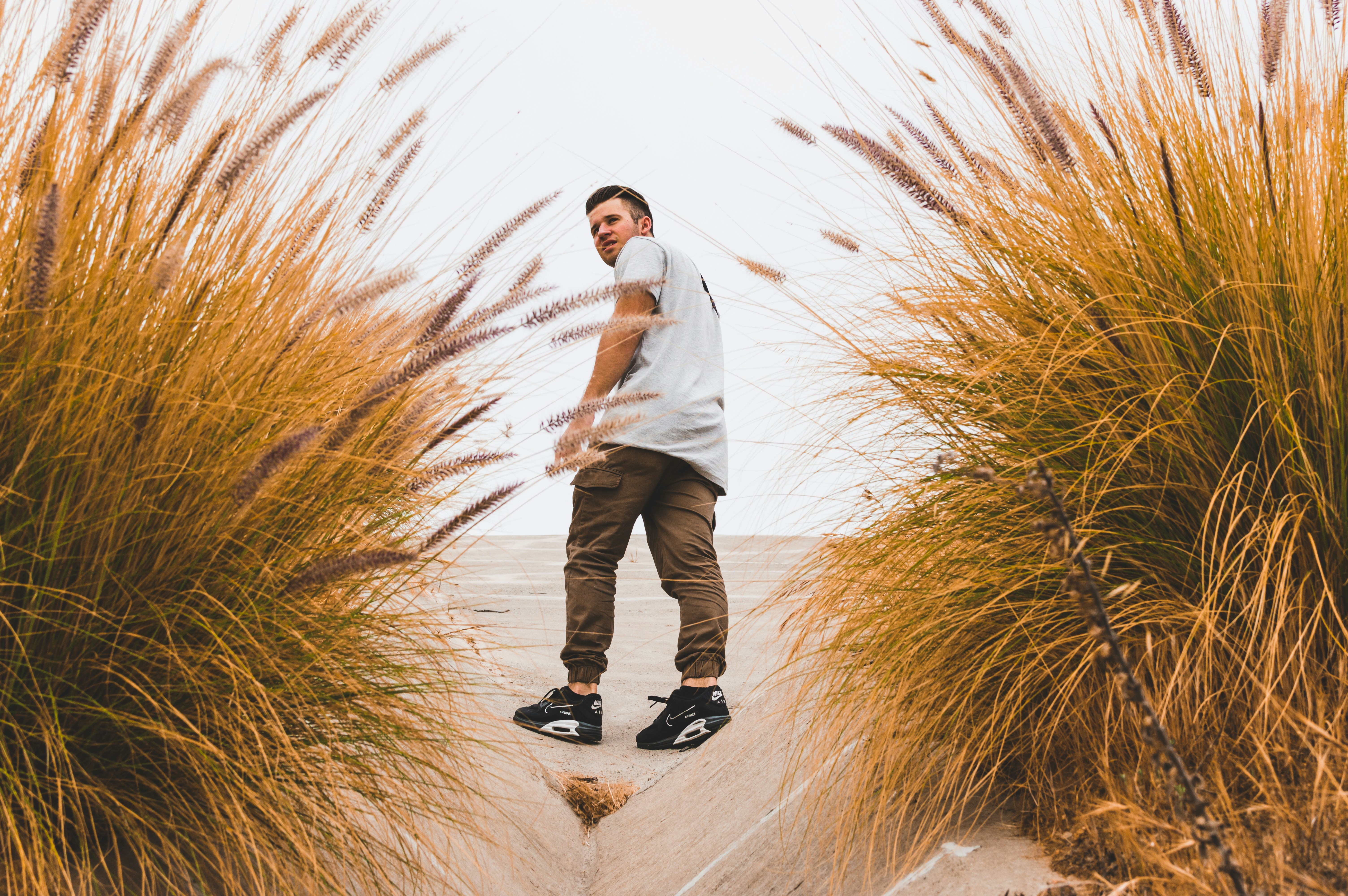 &quot;Man in sneakers at beach&quot;