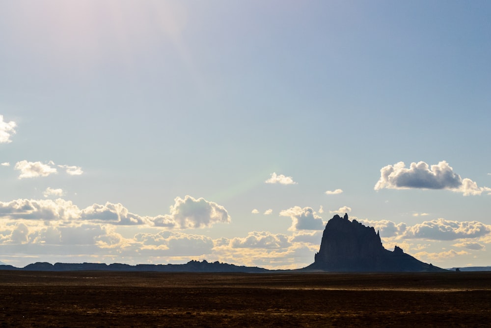 grey stone formation under blue sky