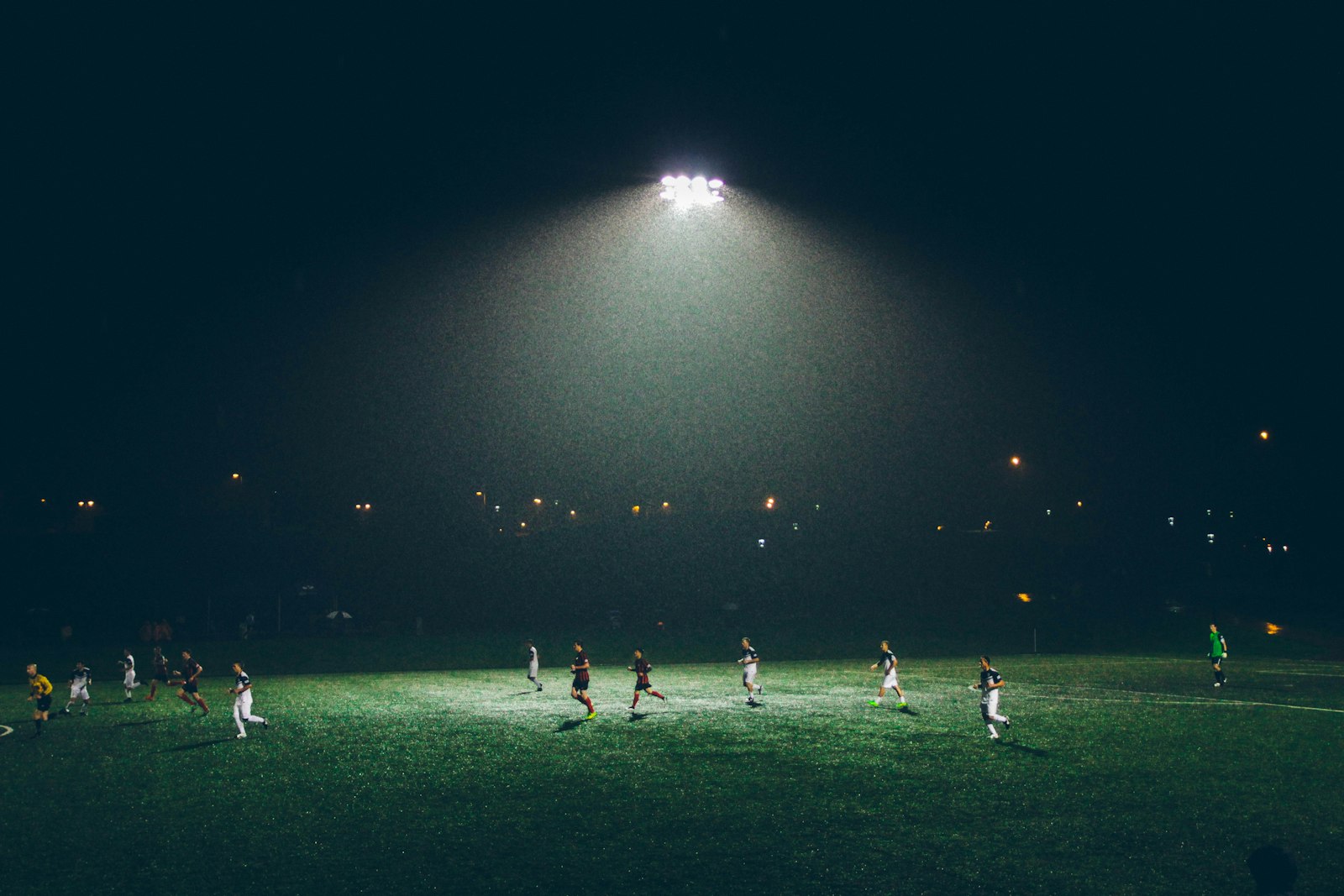 Football players on pitch during training session Dubai