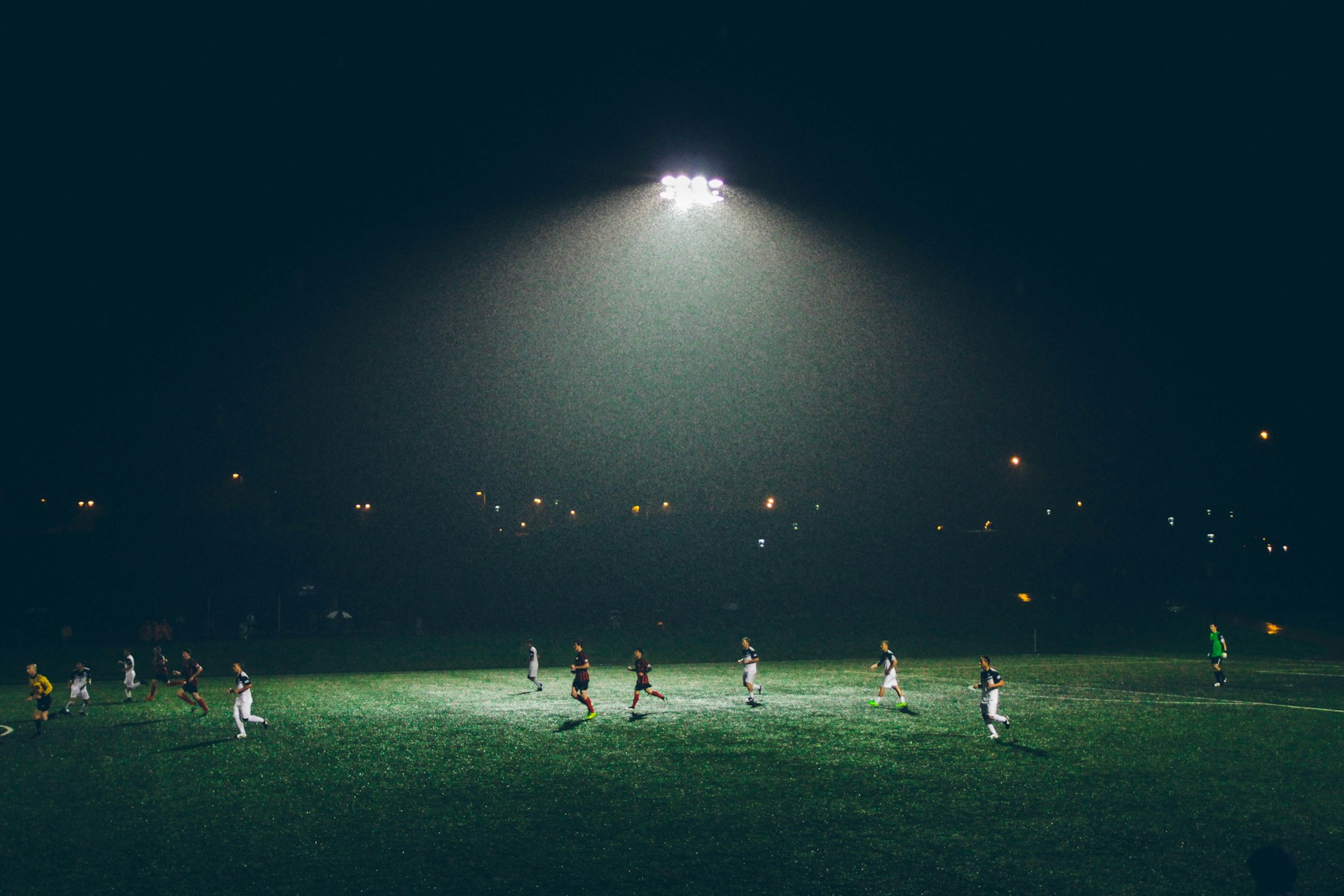 Football pitch under floodlights