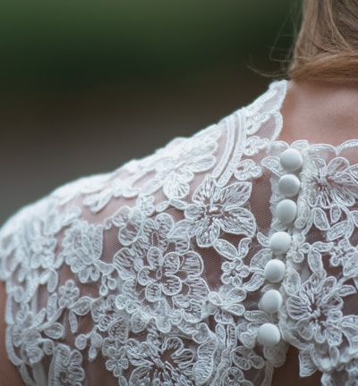 woman wearing white lace dress
