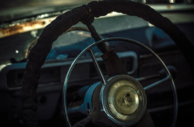 Close-up of a slightly worn car steering wheel ready for resale.