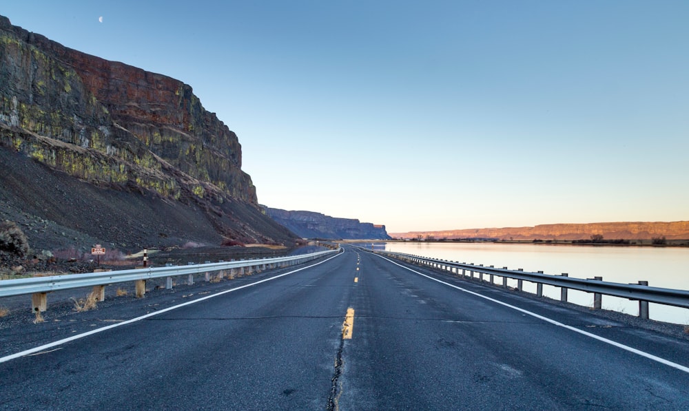 cement highway leading to mountain ranges