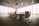oval brown wooden conference table and chairs inside conference room