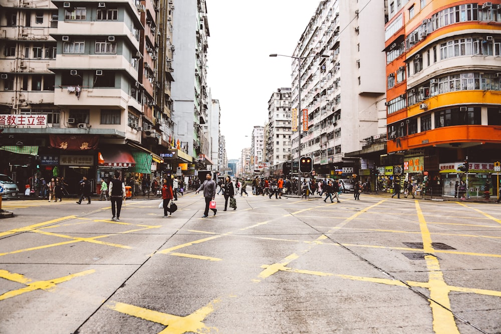 people near orange concrete building