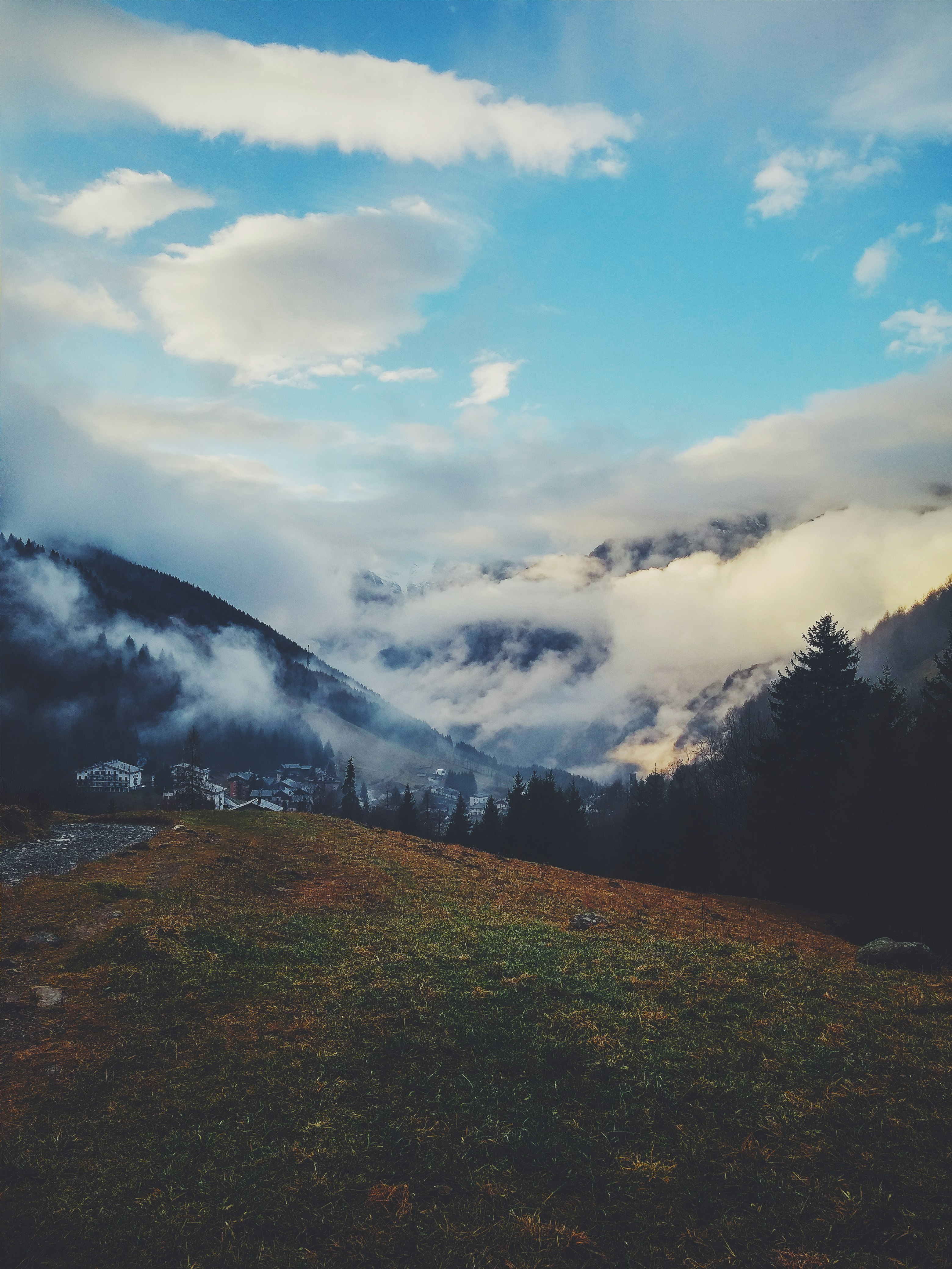 photo of clouds covering mountain