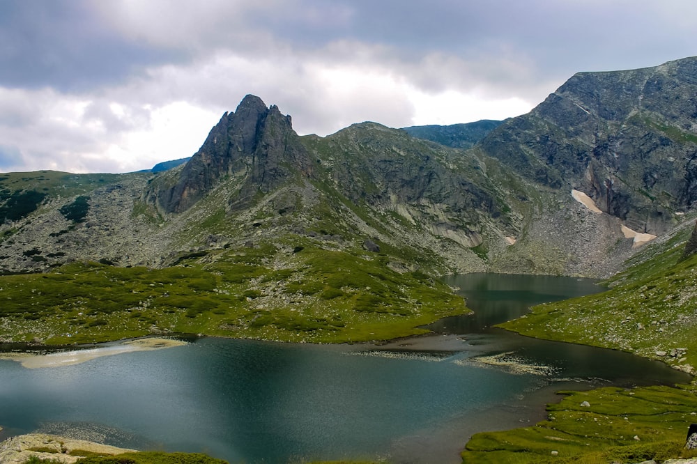 body of water surrounded by mountains