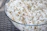 A close-up of a bowl filled with pristine white makhana, highlighting its natural texture.