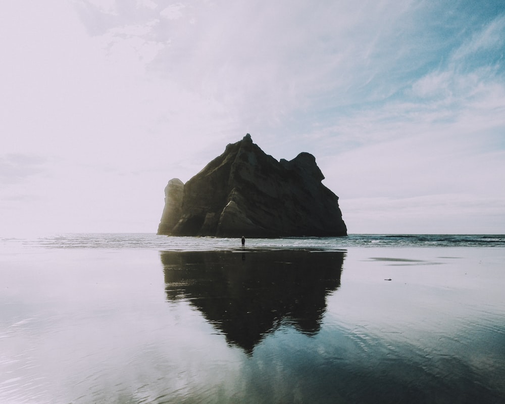 rock formation on body of water