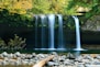 long-exposure photo of lake with waterfall at daytime