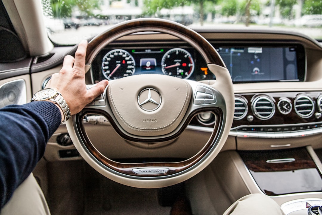 person sitting in Mercedes-Benz driver seat, Driving a Mercedes