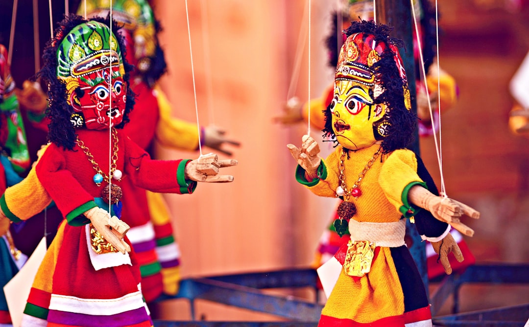 selective focus photography of deity marionettes