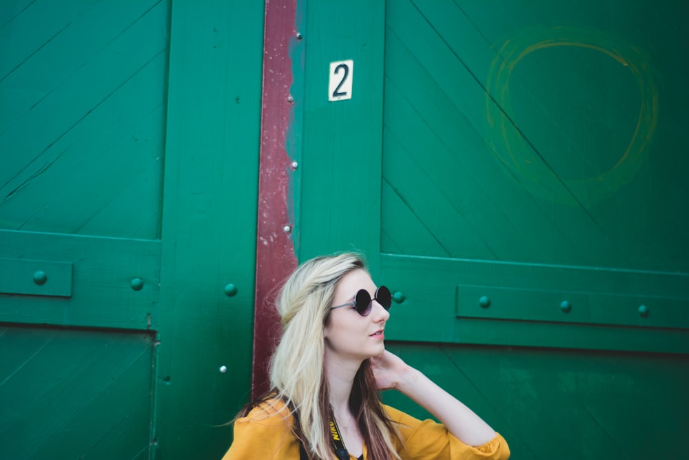 woman leaning on door