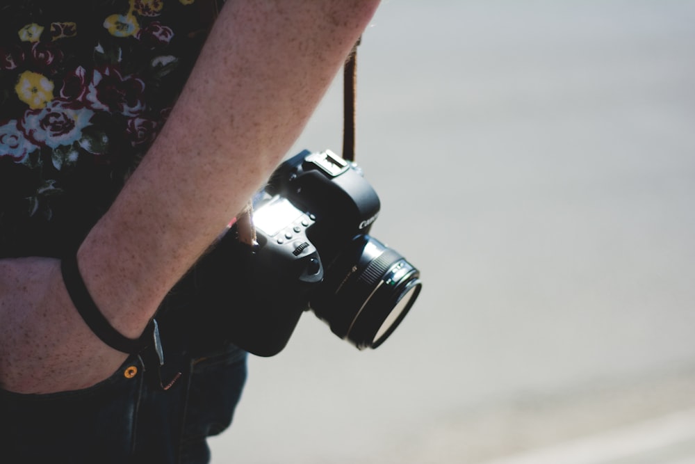 person carrying bridge camera